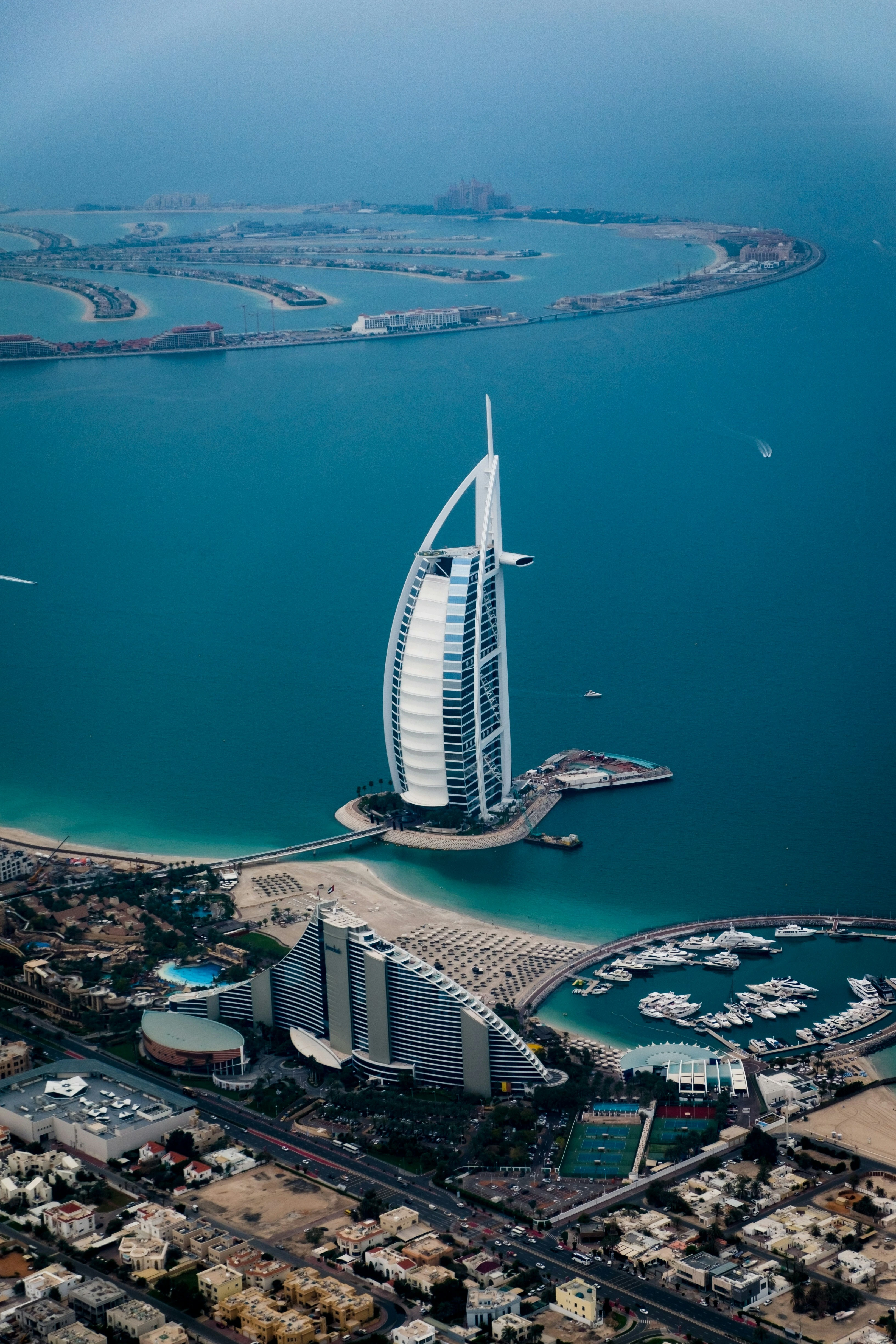Aerial view of Burj Al Arab and Dubai coastline, representing UAE career destinations.